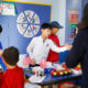 Students at Qingdao International School participating in a classroom project on cultural exchange, showcasing interactive learning at Qingdao Amerasia International School.